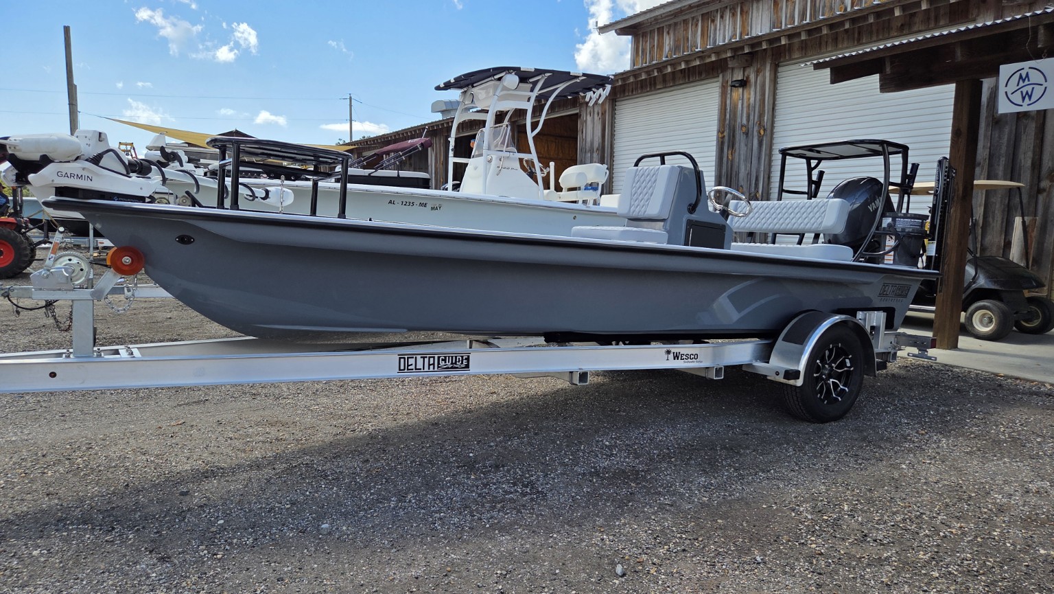 Side profile of the customized 2027 Delta D18 on its Delta Guide trailer.